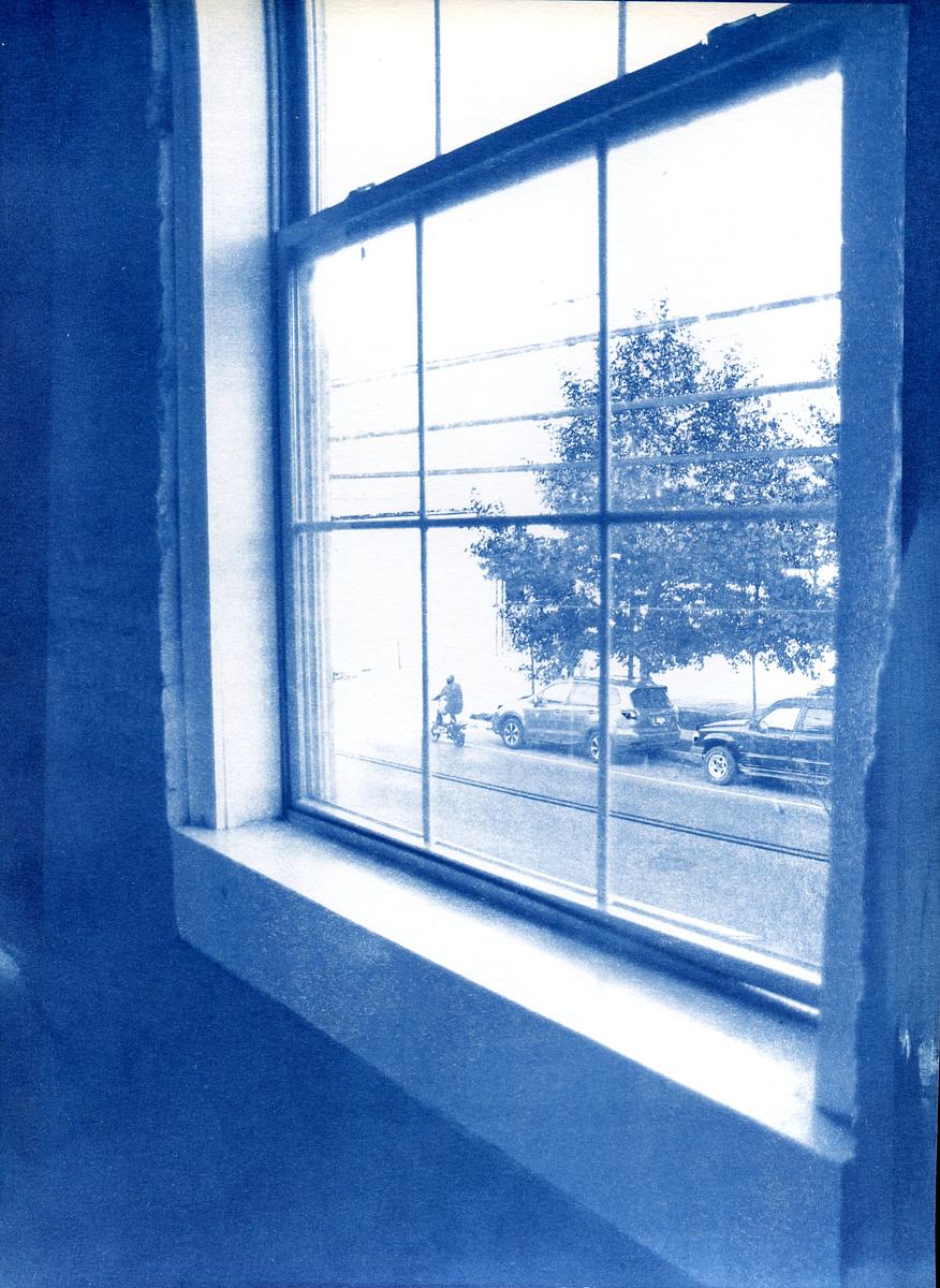 peering through a stairwell window 